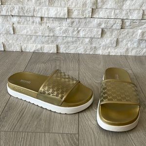 MK  gold slip on flat sandals
